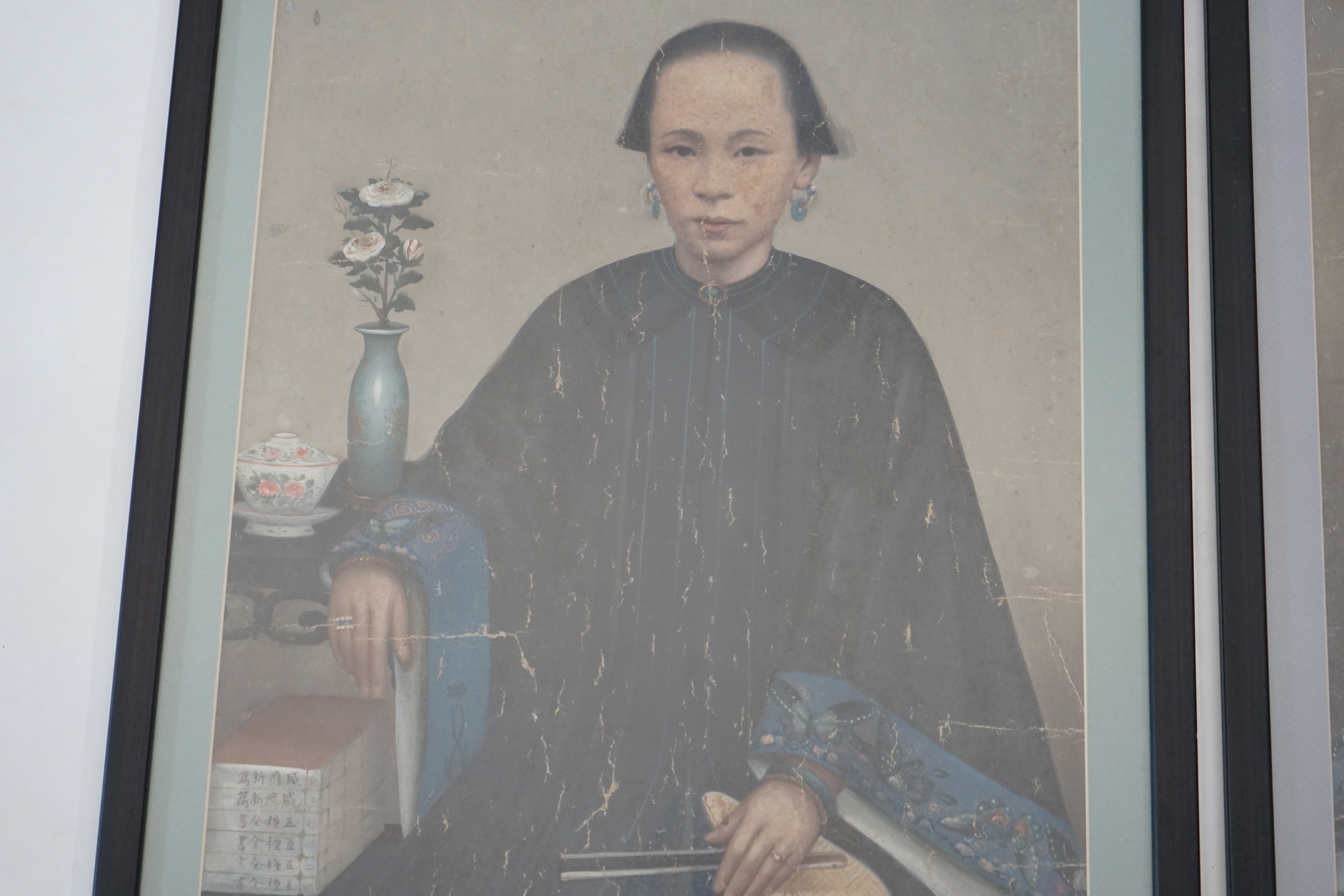 China Trade, late Qing dynasty, two portraits of Qing ladies, oil on canvas, each 63 x 47cm, later framed and glazed. Condition - poor to fair